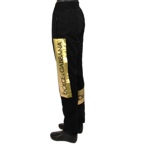 Cotton Track Pants / Joggings with DG Logo patches, elastic waist and zipped pockets in black by DOLCE & GABBANA