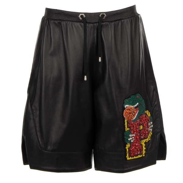 "Warrior" leather shorts embellished with crystal dinosaur logo patch in black by PHILIPP PLEIN